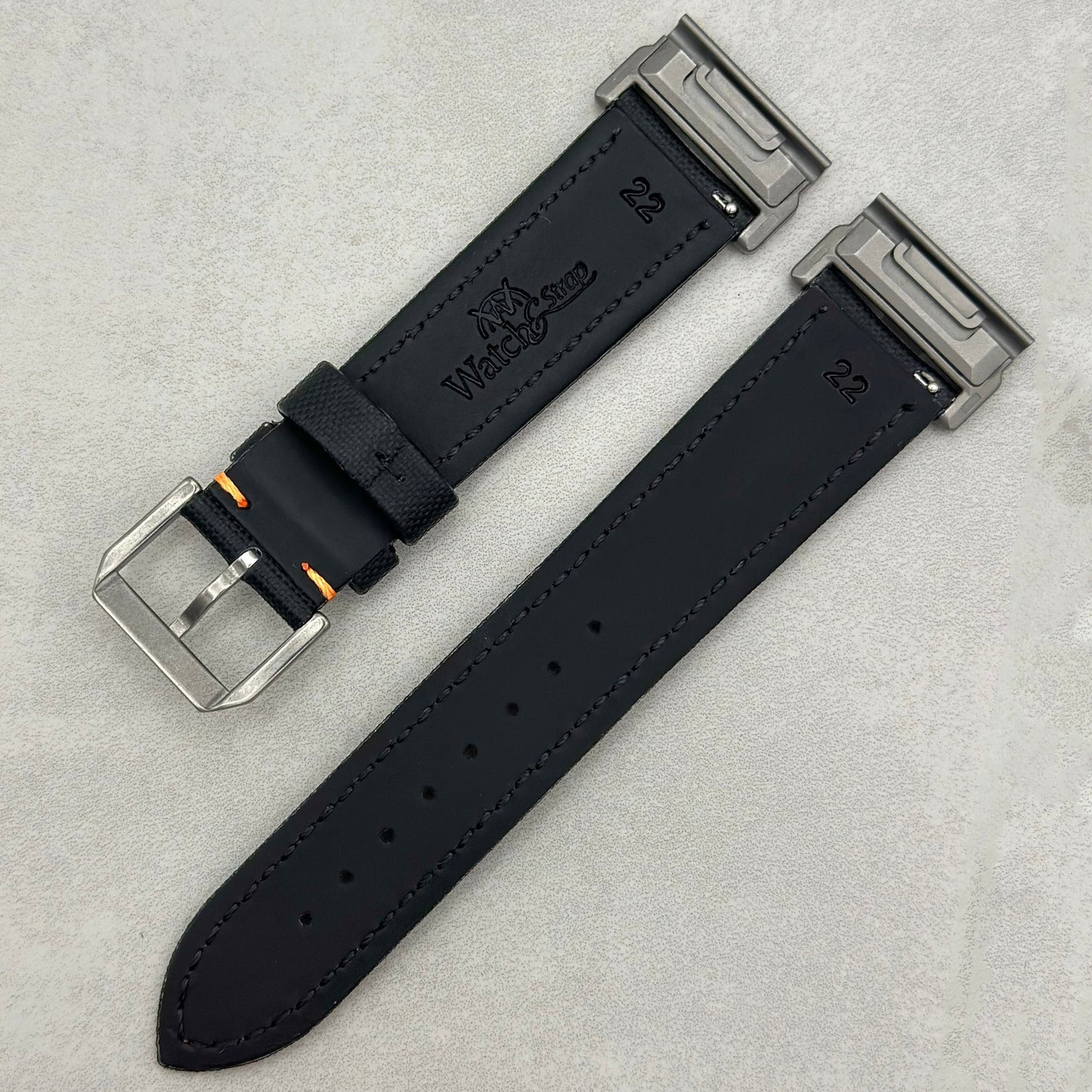 Rear of the Bermuda black sail cloth Garmin Quickfit watch strap with contrast orange stitching.