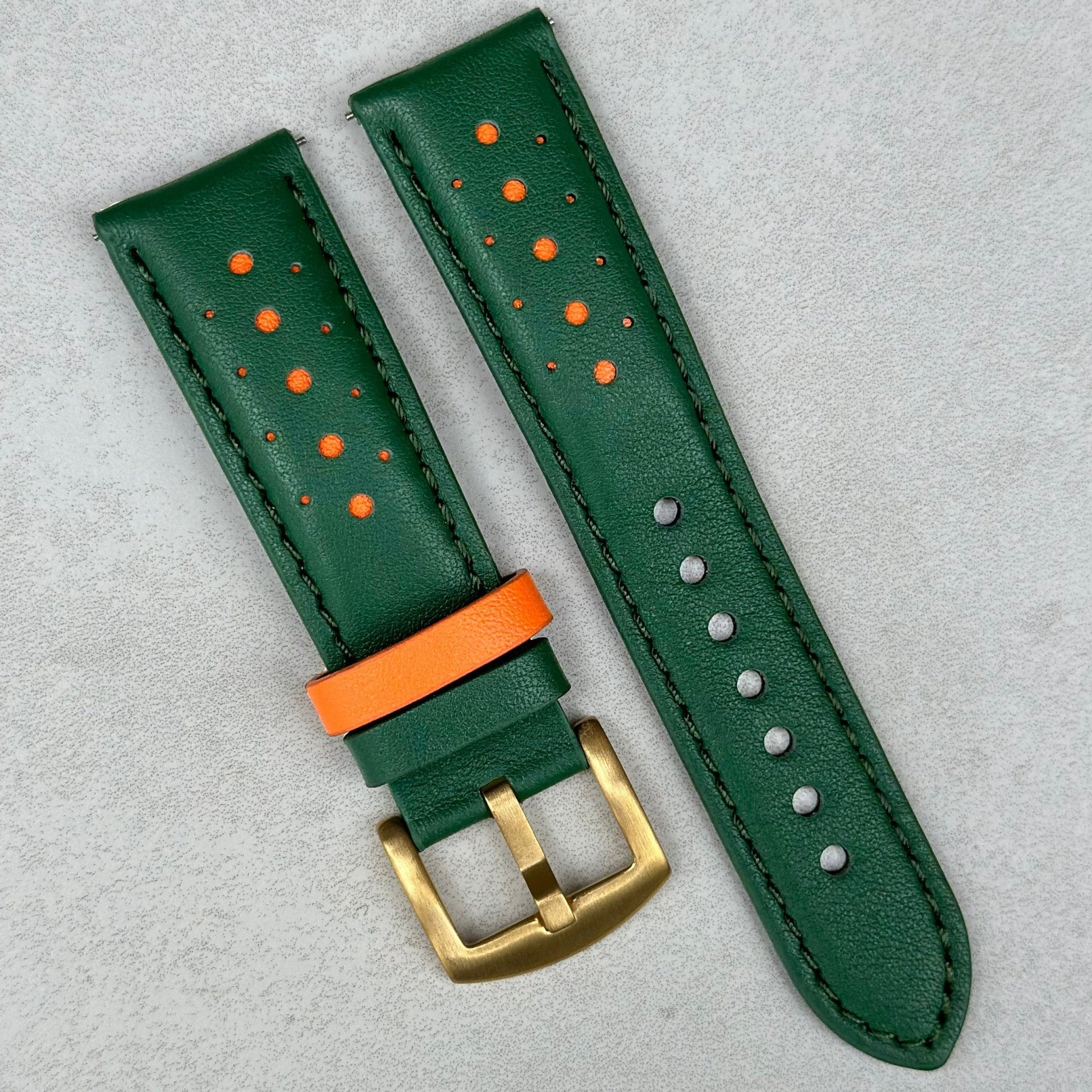 Le Mans green and orange full grain leather watch strap with a gold buckle. 18mm, 20mm, 22mm, 24mm.