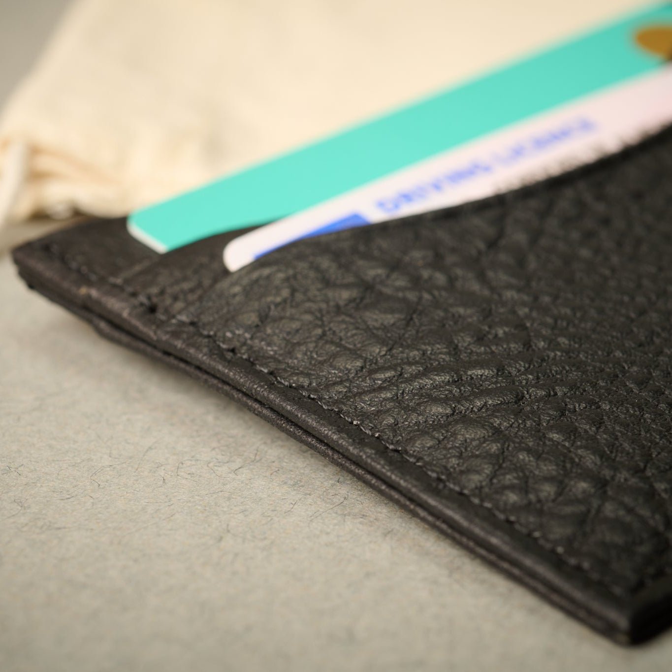 Close up of the Rome Black full grain Italian leather card case. RFID Blocking technology. 5 card slots.