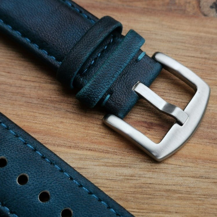 close up of the 316L stainless steel buckle on the Milan blue apple watch strap.