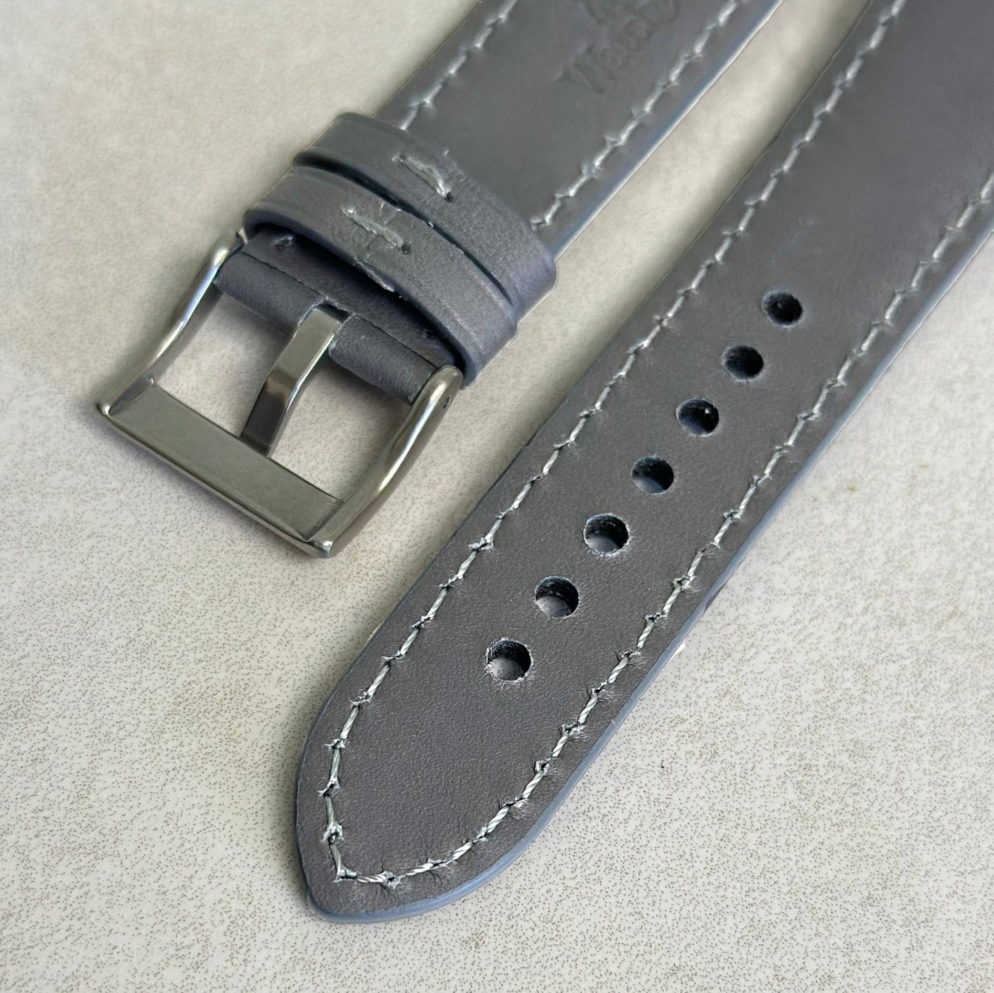Underside of the brushed 316L stainless steel buckle on the Athens grey full grain leather watch strap. Watch And Strap.
