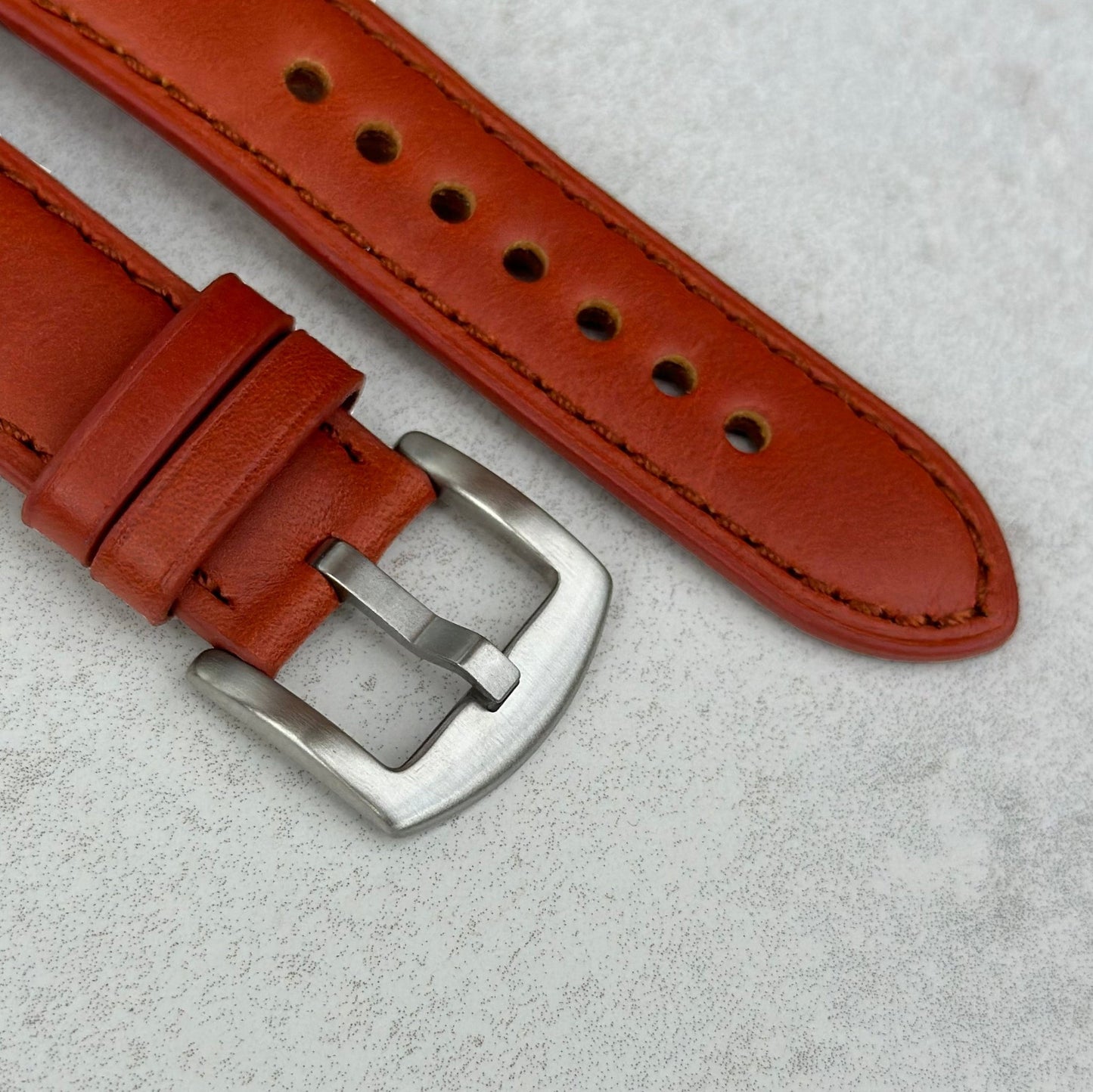 Brushed 316L stainless steel buckle on the Athens burnt Cinnamon leather Apple watch strap.