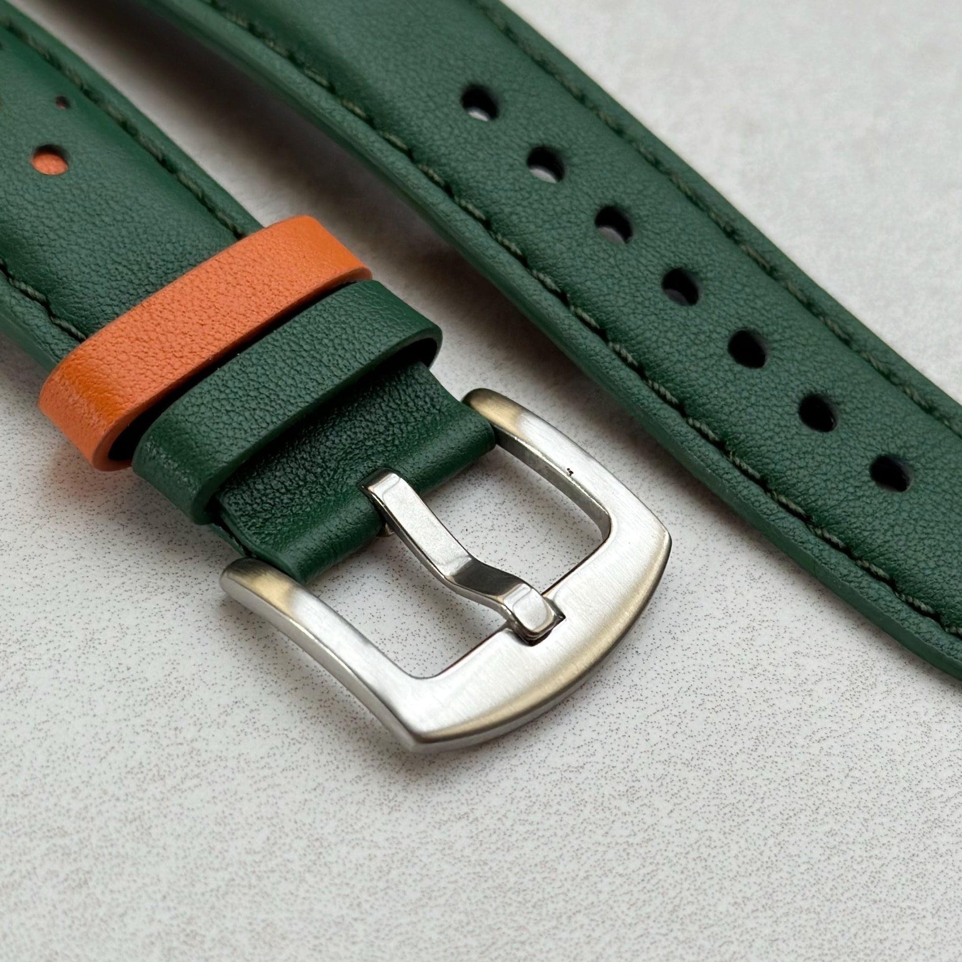 Brushed 316L stainless steel buckle on the Le Mans green and orange full grain leather watch strap.