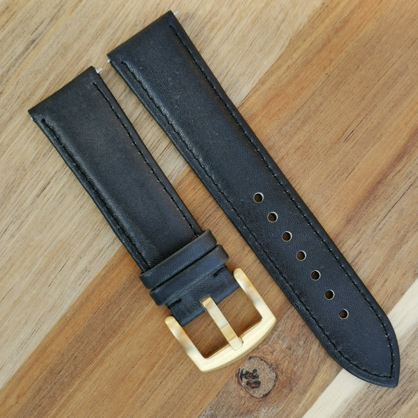 Milan black vegetable tanned leather watch strap. Fitted with a gold 316L stainless steel buckle.