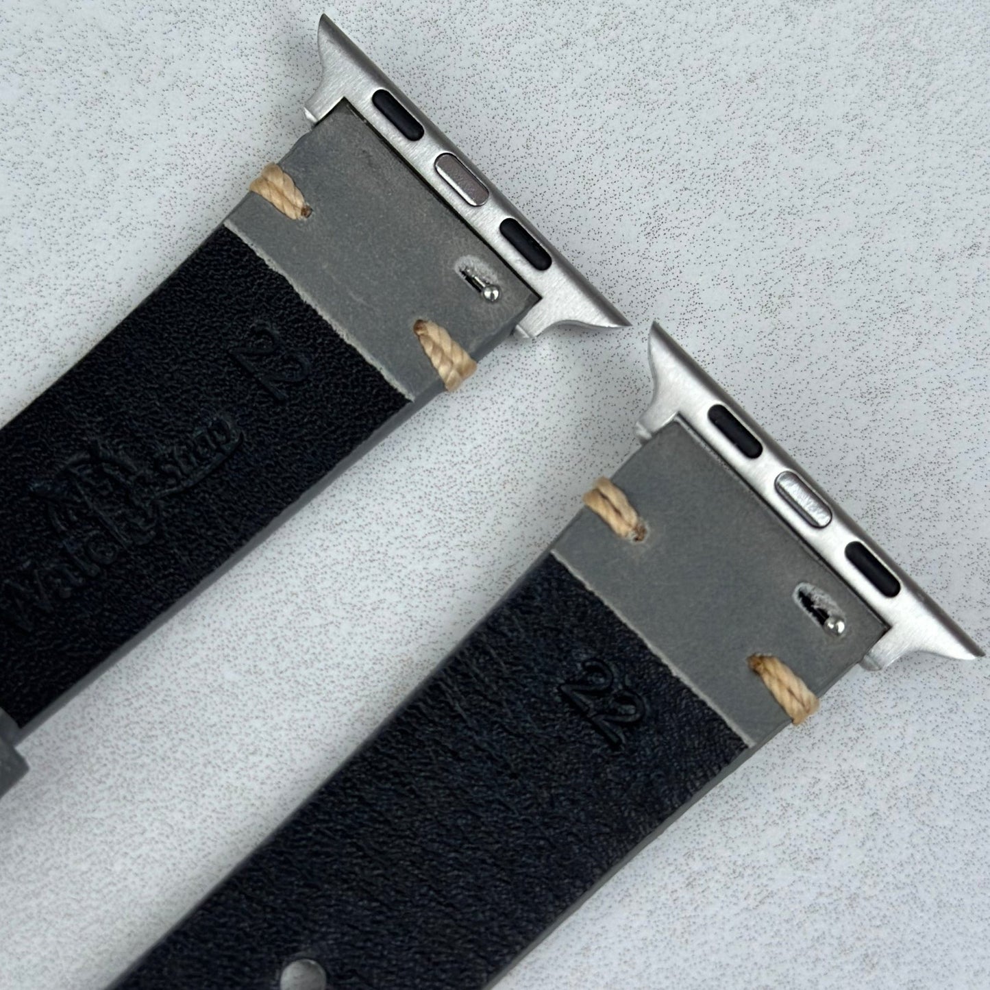 Rear top of the Madrid grey full grain leather watch strap. 316L stainless steel Apple Watch connectors.
