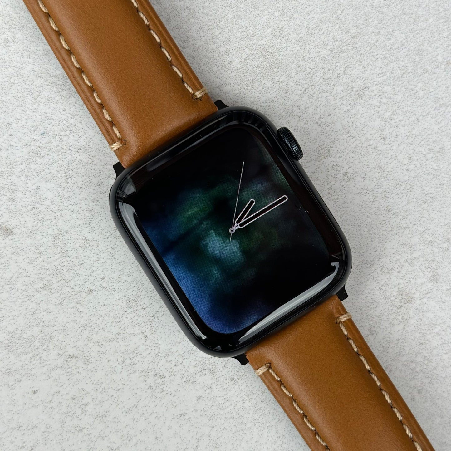 Oslo tan full grain leather watch strap on the Apple Watch Series 9. Contrast ivory stitching. Watch And Strap