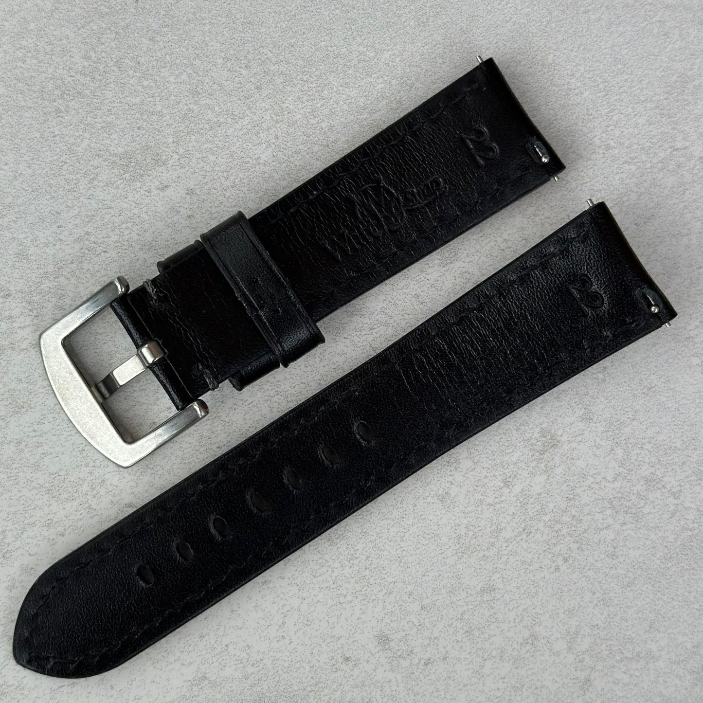 Rear of the Prague jet black vegetable tanned leather watch strap. Quick release pins. Watch And Strap logo.