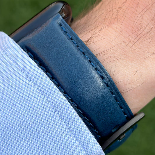 Wrist shot of the Prague marine blue vegetable tanned leather watch strap. On the Apple Watch Series 9 black. Watch And Strap