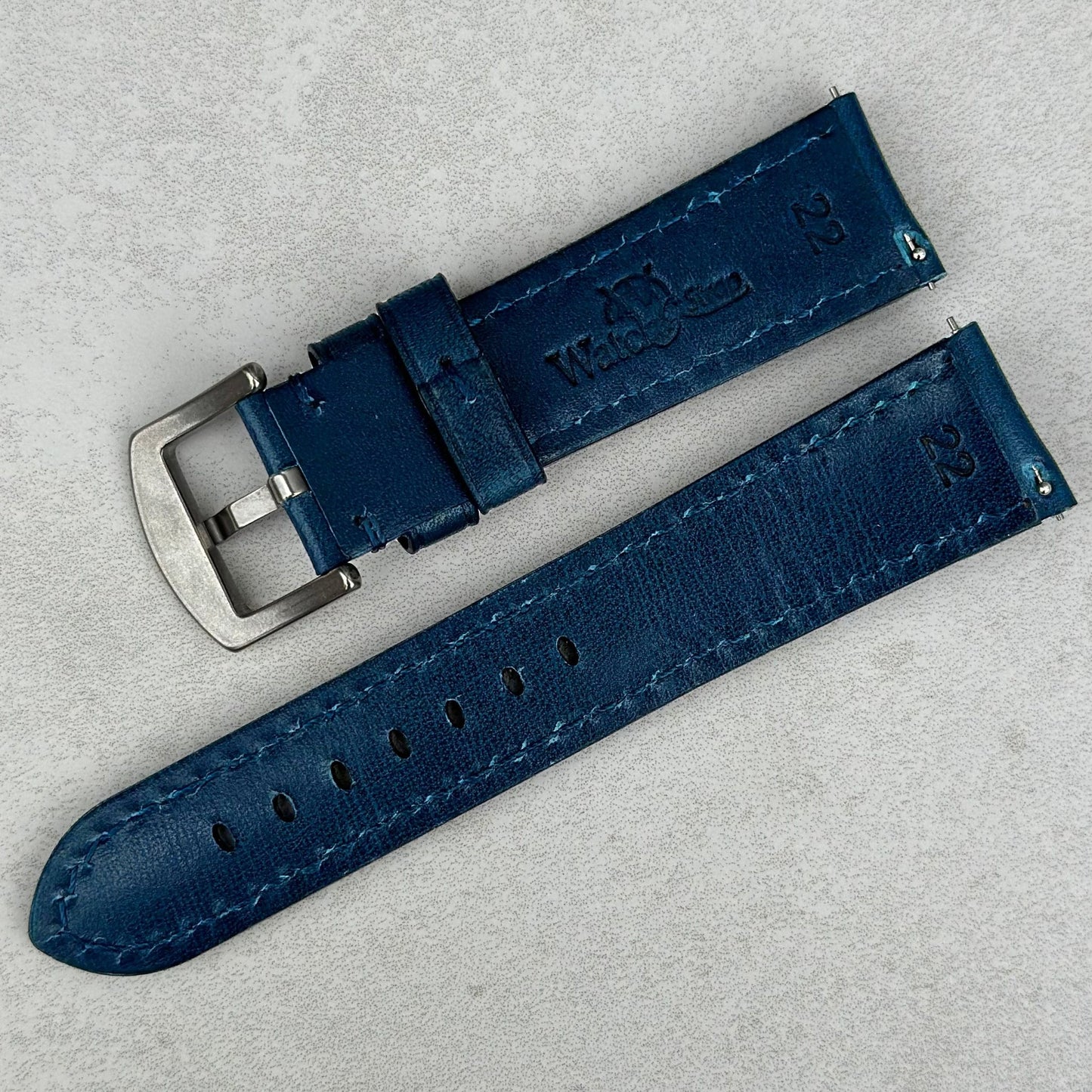 Rear of the Prague marine blue vegetable tanned leather watch strap. Watch And Strap logo. Quick release pins.