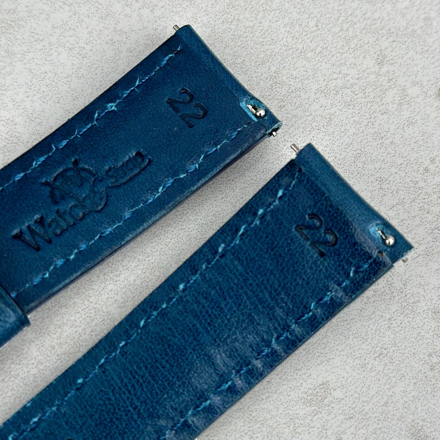 Quick release pins on the Prague marine blue full grain leather watch strap. Watch And Strap logo.