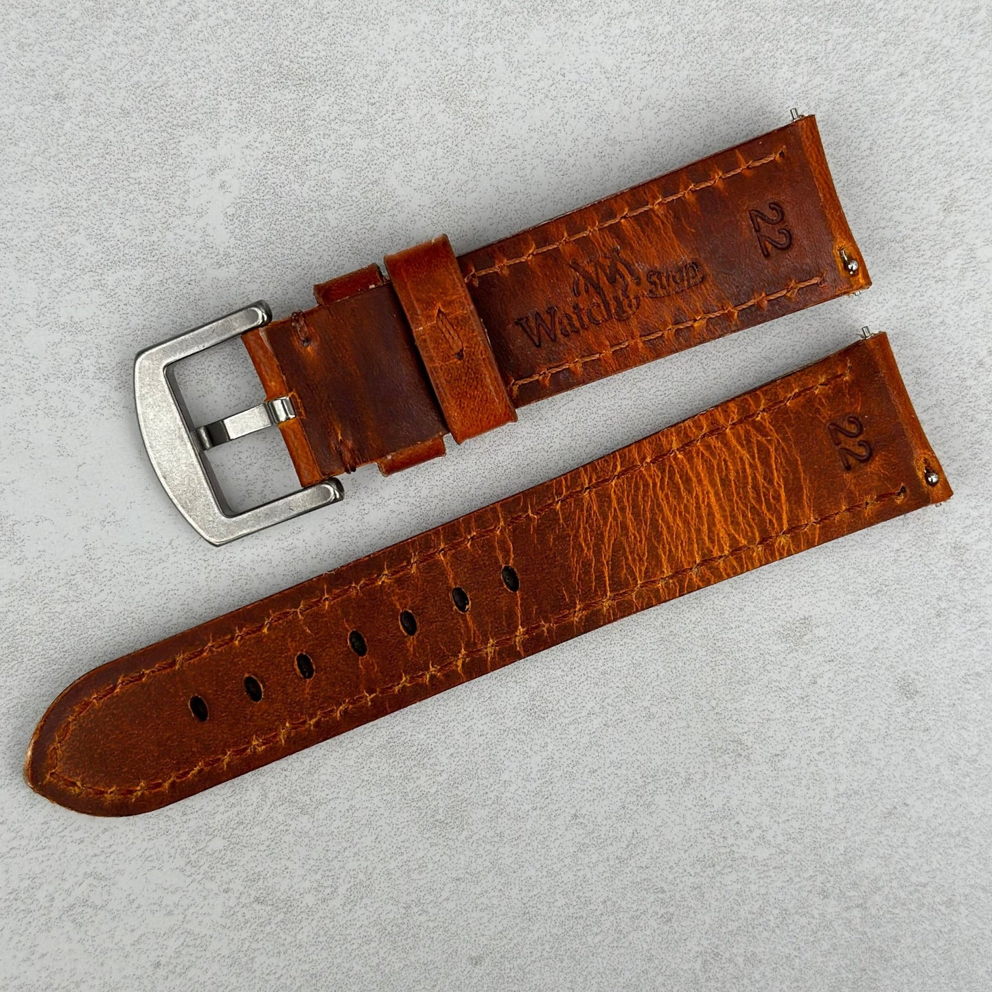 Underside of the Prague cognac brown leather watch strap. Quick release pins. Watch And Strap logo.