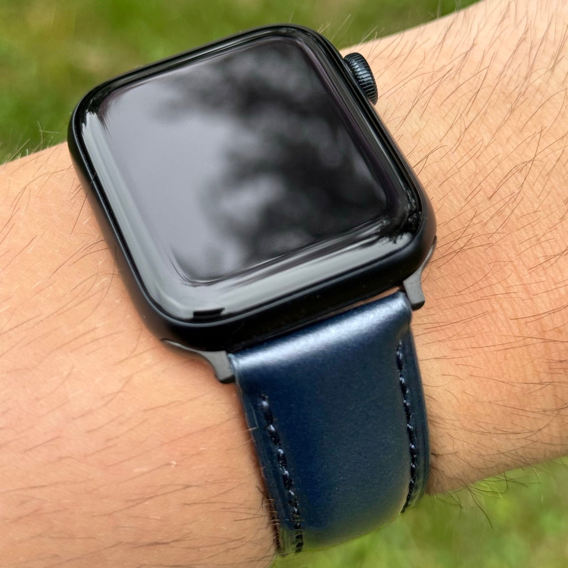 Wrist shot of the Athens blue Apple Watch Strap. Blue vegetable tanned leather. Apple Watch Series 11.