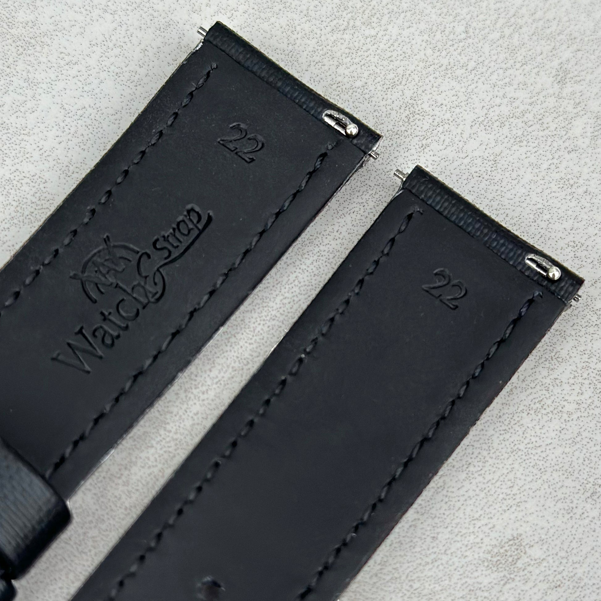 Quick release pins on the Bermuda jet black sail cloth watch strap. Watch And Strap logo.