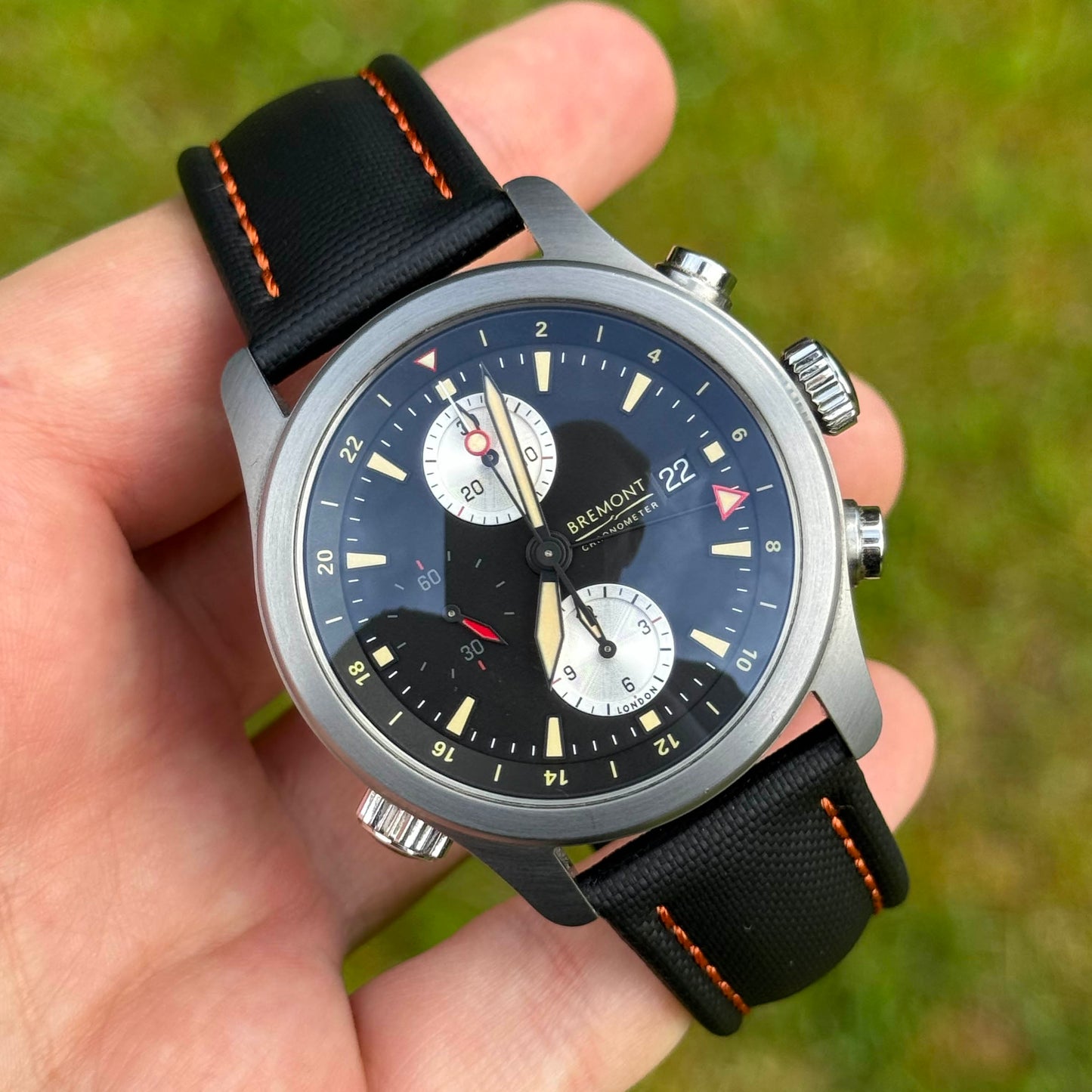Bermuda jet black sailcloth watch strap on the Bremont Alt1. Contrast orange stitching. 19mm, 20mm, 21mm, 22mm.