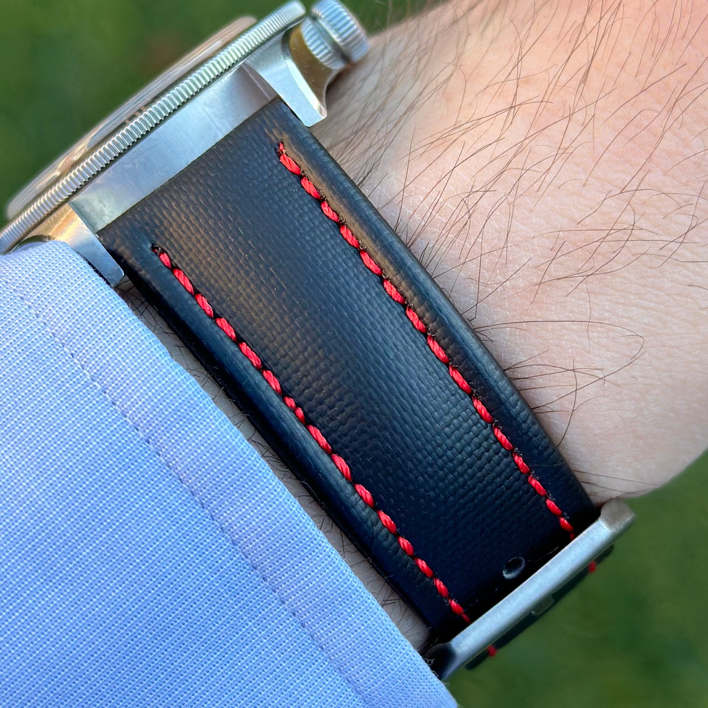 Wrist shot of the Bermuda jet black sail cloth watch strap with red stitching. On the Tudor Blackbay 58. Watch And Strap