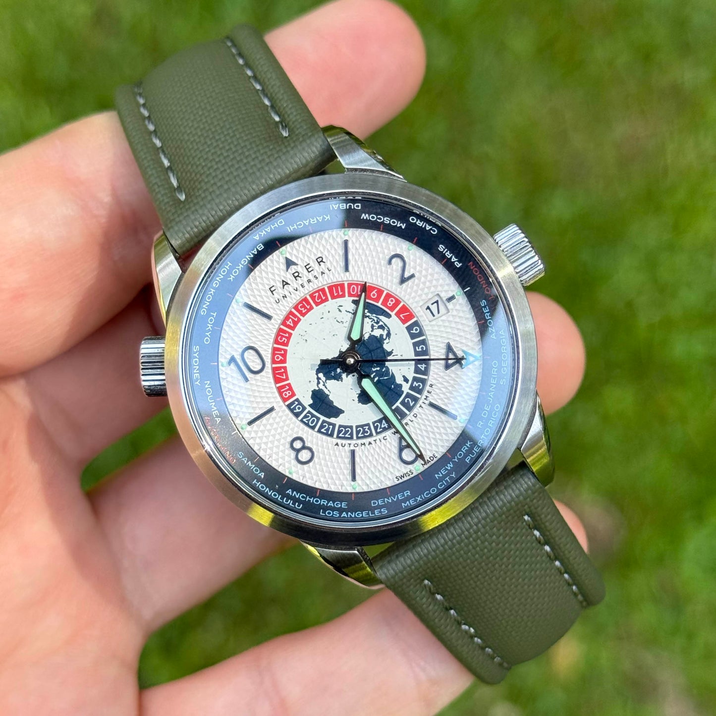 Bermuda khaki green sailcloth watch strap with grey stitching on the Farer Worldtimer. 19mm, 20mm, 21mm, 22mm.