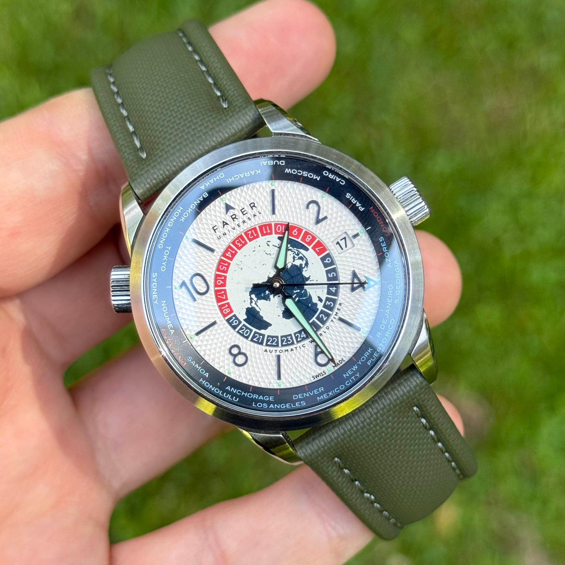 Bermuda khaki green sailcloth watch strap with grey stitching on the Farer Worldtimer. 19mm, 20mm, 21mm, 22mm.