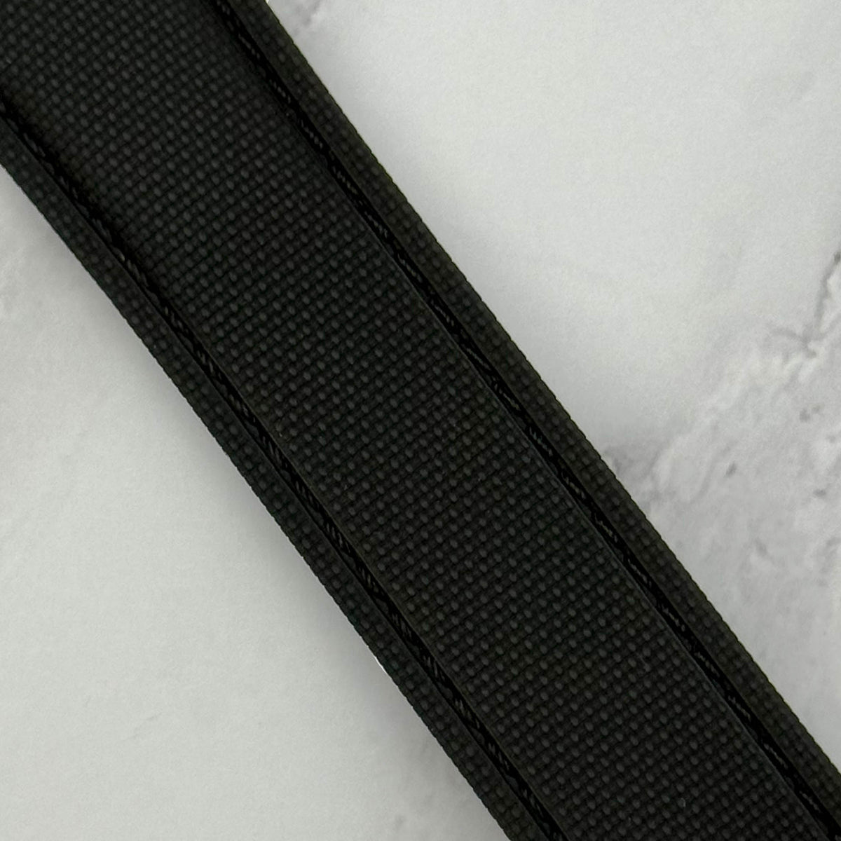 Jet black FKM rubber watch strap. 316L stainless steel deployant clasp. Quick release pins. 20mm, 22mm.