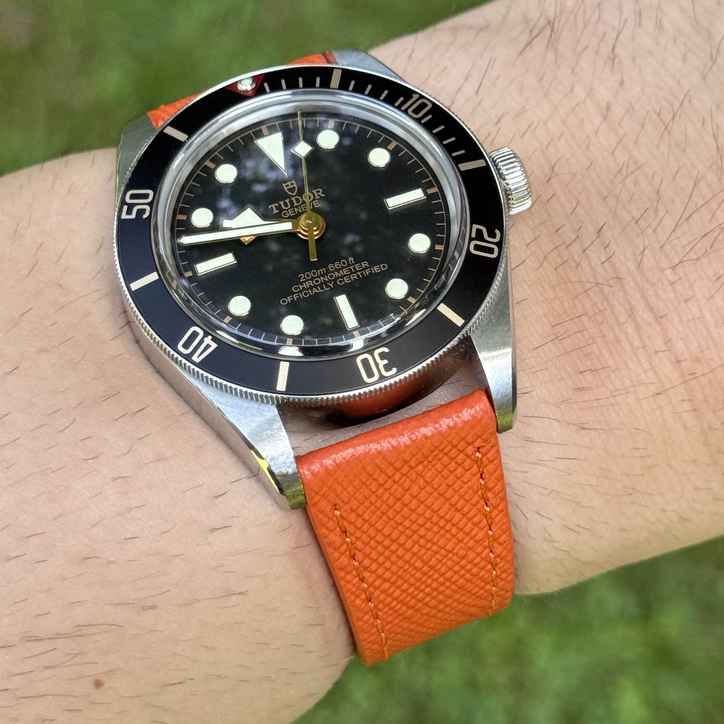 Wrist shot of the Florence orange saffiano leather watch strap. 18mm, 20mm, 22mm, 24mm. Watch And Strap