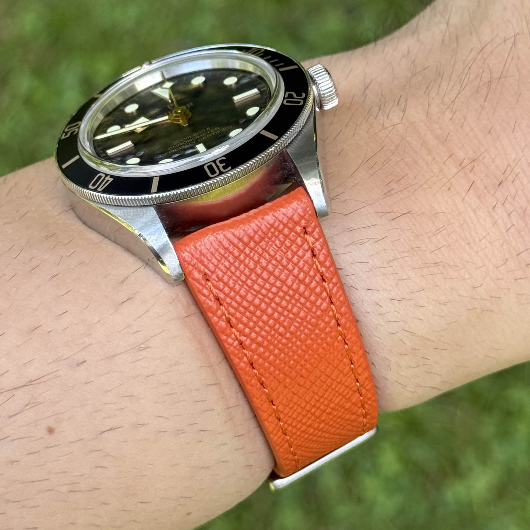 Wrist shot of the Florence orange saffiano leather watch strap. 18mm, 20mm, 22mm, 24mm. Watch And Strap