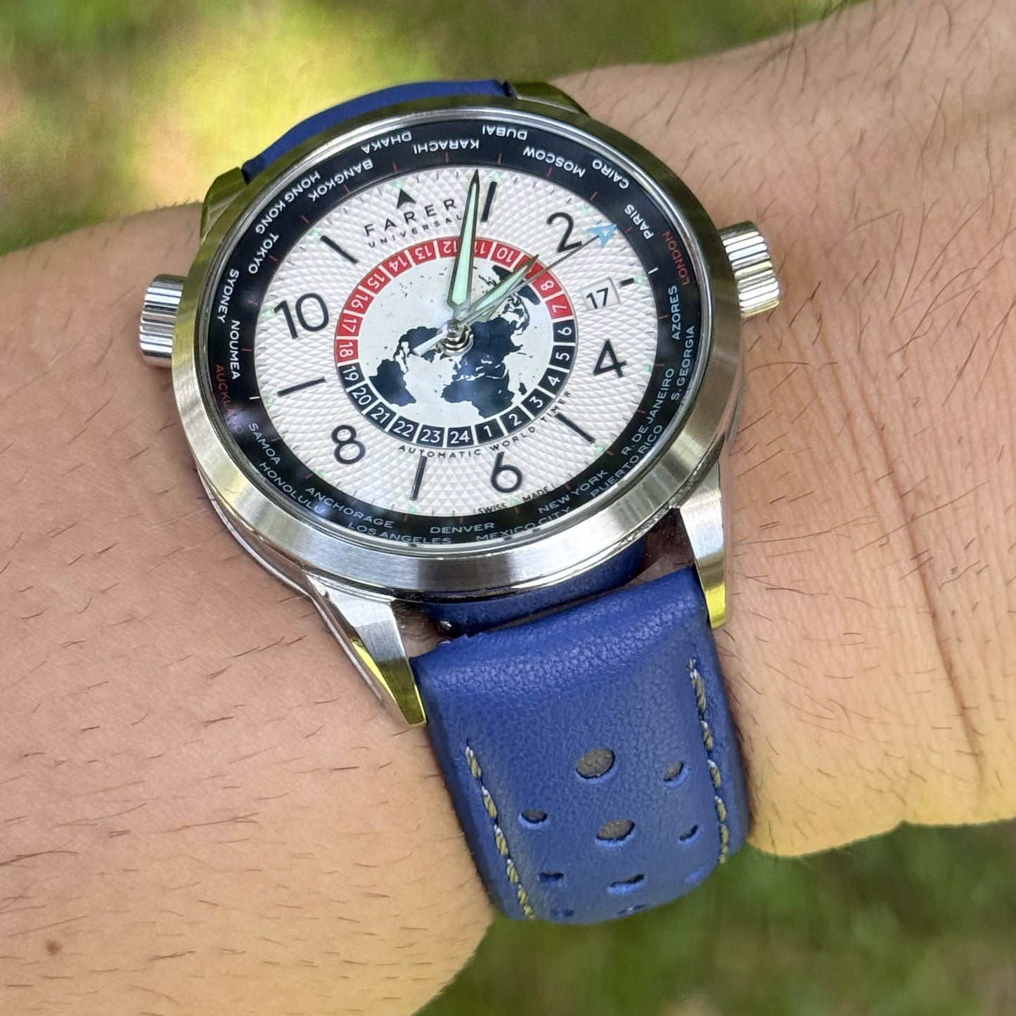 Le Mans blue and grey full grain leather racing watch strap on a males wrist. 18mm, 20mm, 22mm, 24mm.