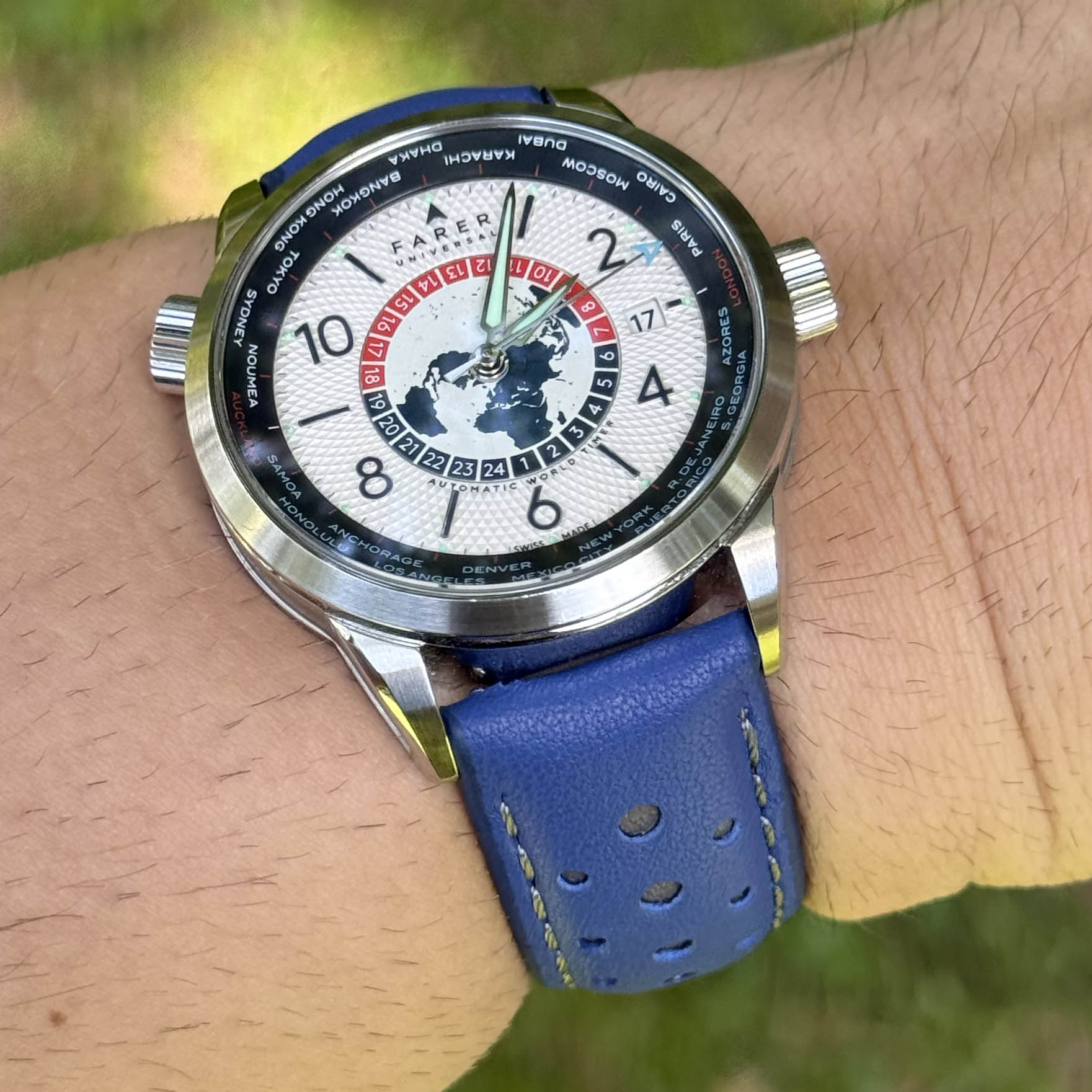 Le Mans blue and grey full grain leather racing watch strap on a males wrist. 18mm, 20mm, 22mm, 24mm.
