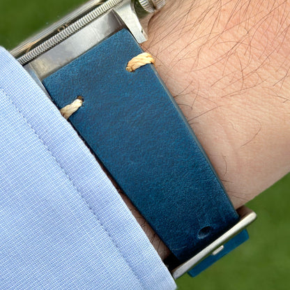 Wrist shot of the blue full grain leather watch strap on the Tudor Blackbay 58. Contrast ivory stitching. Watch And Strap