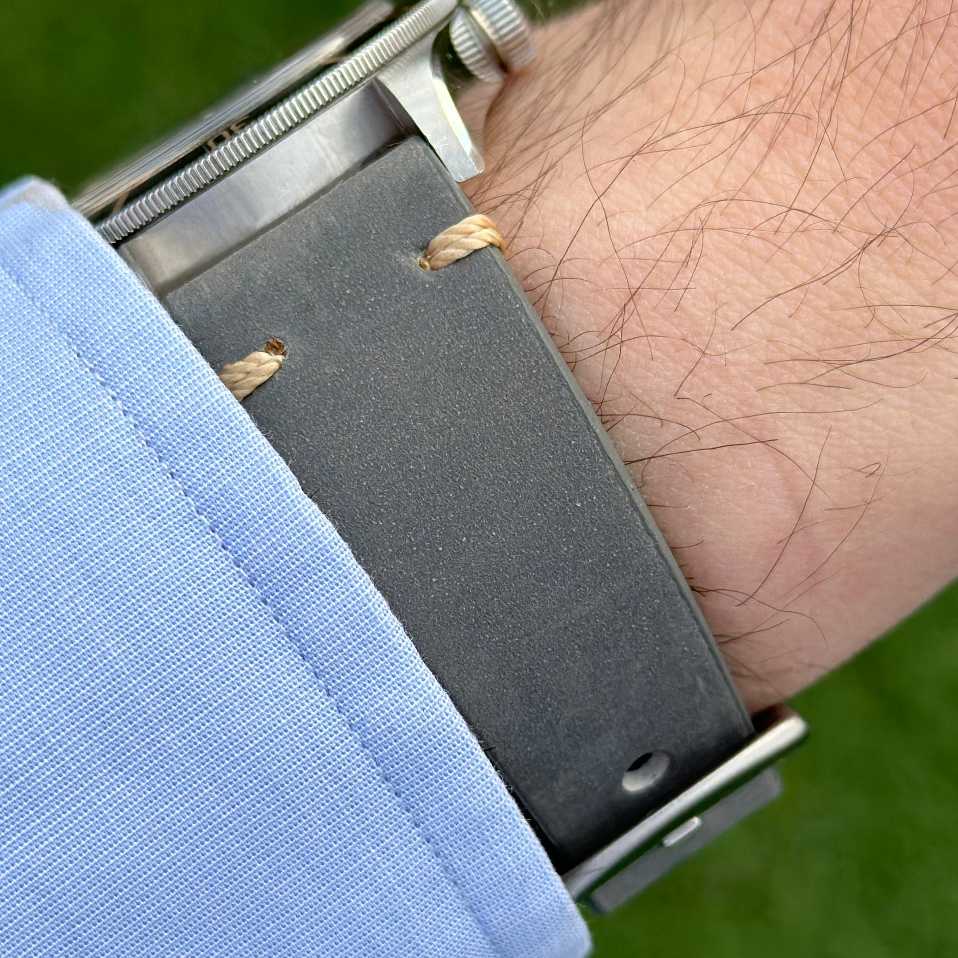 Wrist shot of the Madrid grey full grain leather watch strap. Contrast ivory stitching. 18mm, 20mm, 22mm, 24mm.