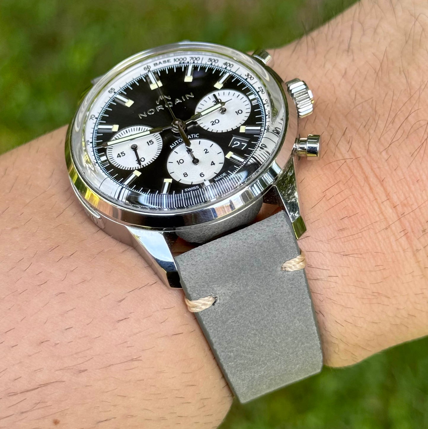 Wrist shot of the Madrid grey full grain leather watch strap. Contrast ivory stitching. Watch And Strap