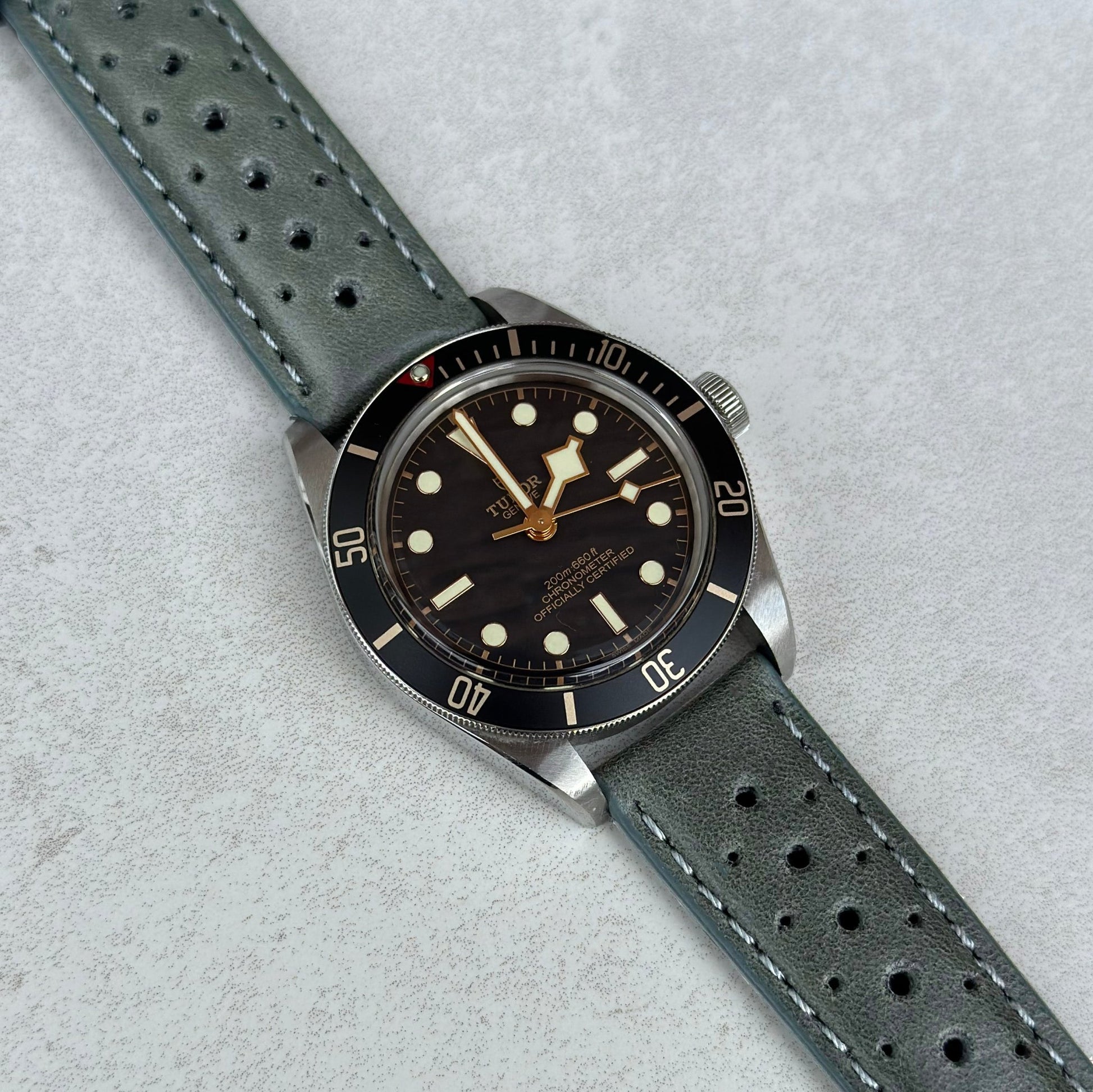 Montecarlo grey full grain leather watch strap on the Tudor Blackbay 58. Perforated leather. Watch And Strap