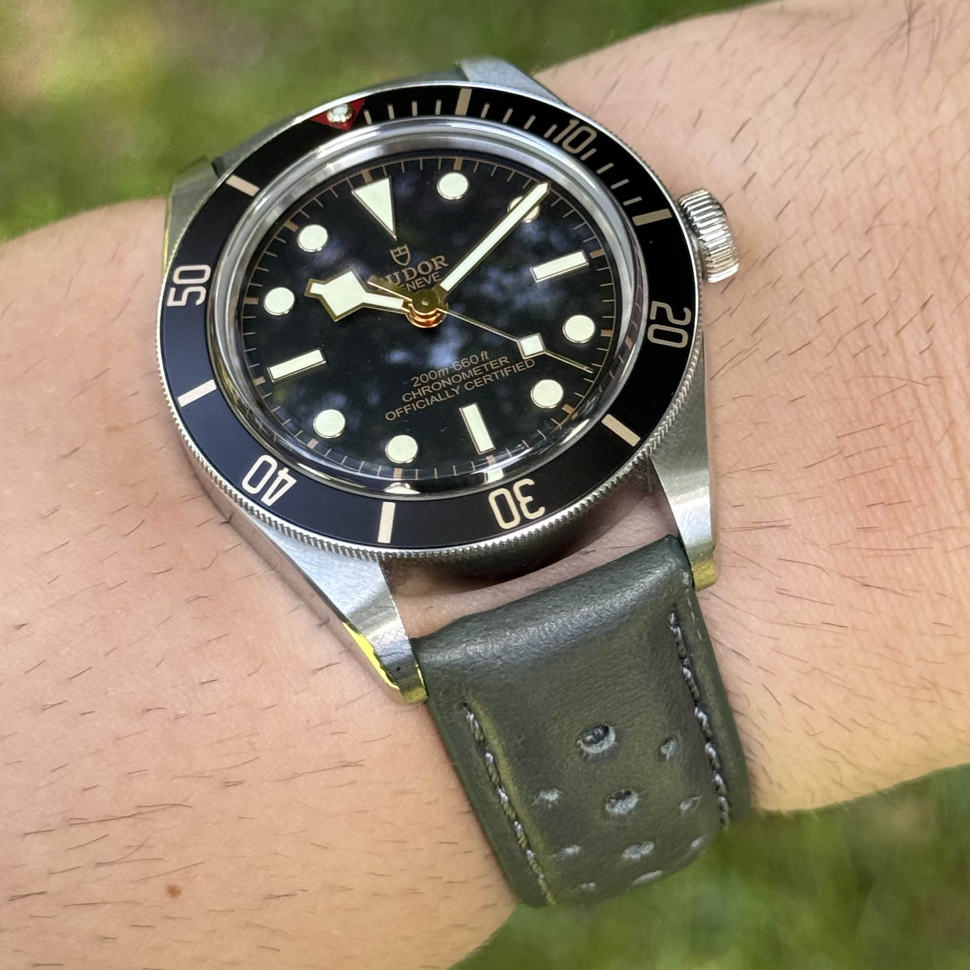 Wrist shot of the Montecarlo grey perforated leather watch strap. On the Tudor Blackbay 58. Watch And Strap.