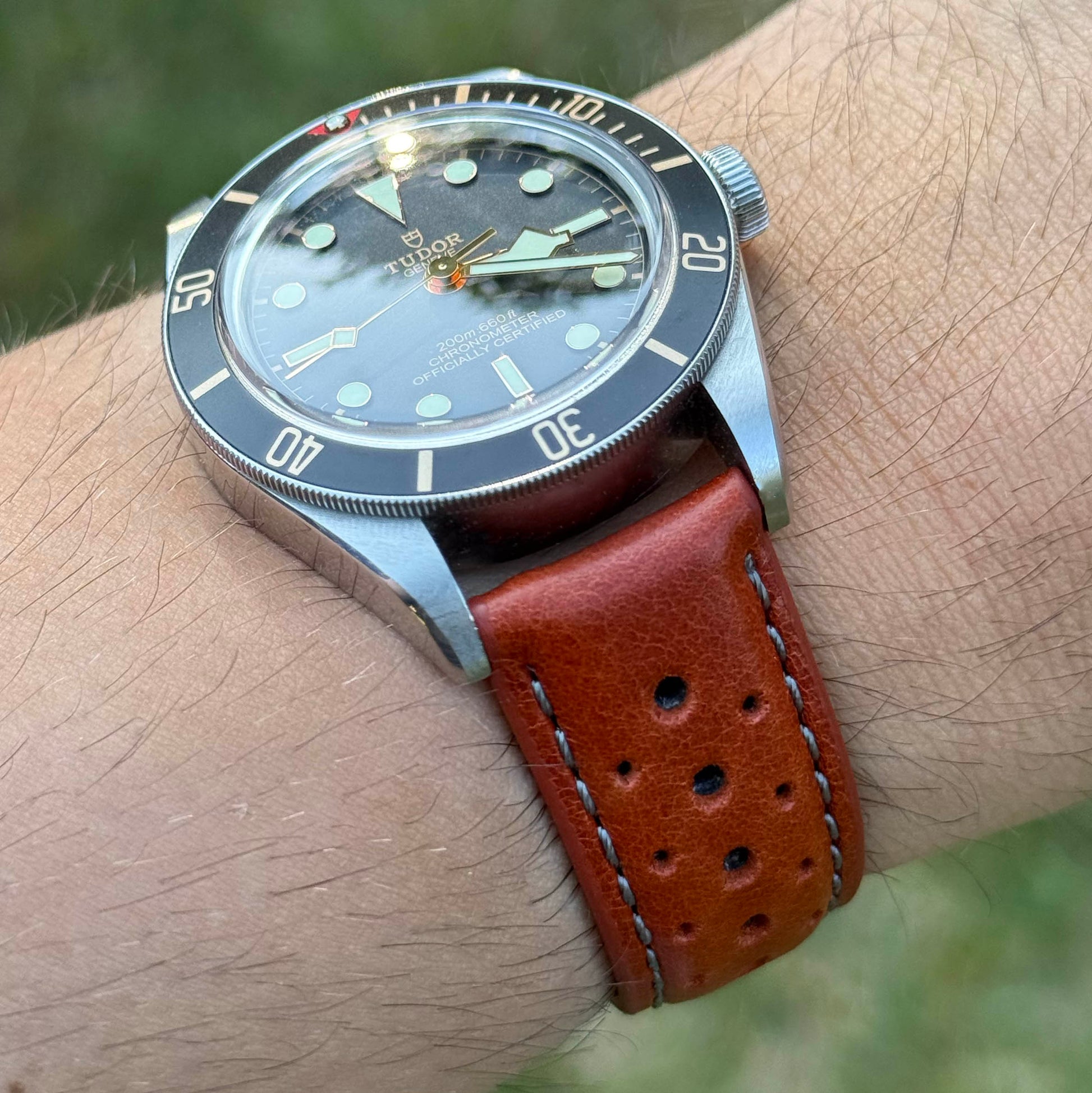 Wrist shot of the Montecarlo orange perforated full grain leather watch strap. 18mm, 20mm, 22mm, 24mm. Watch And Strap
