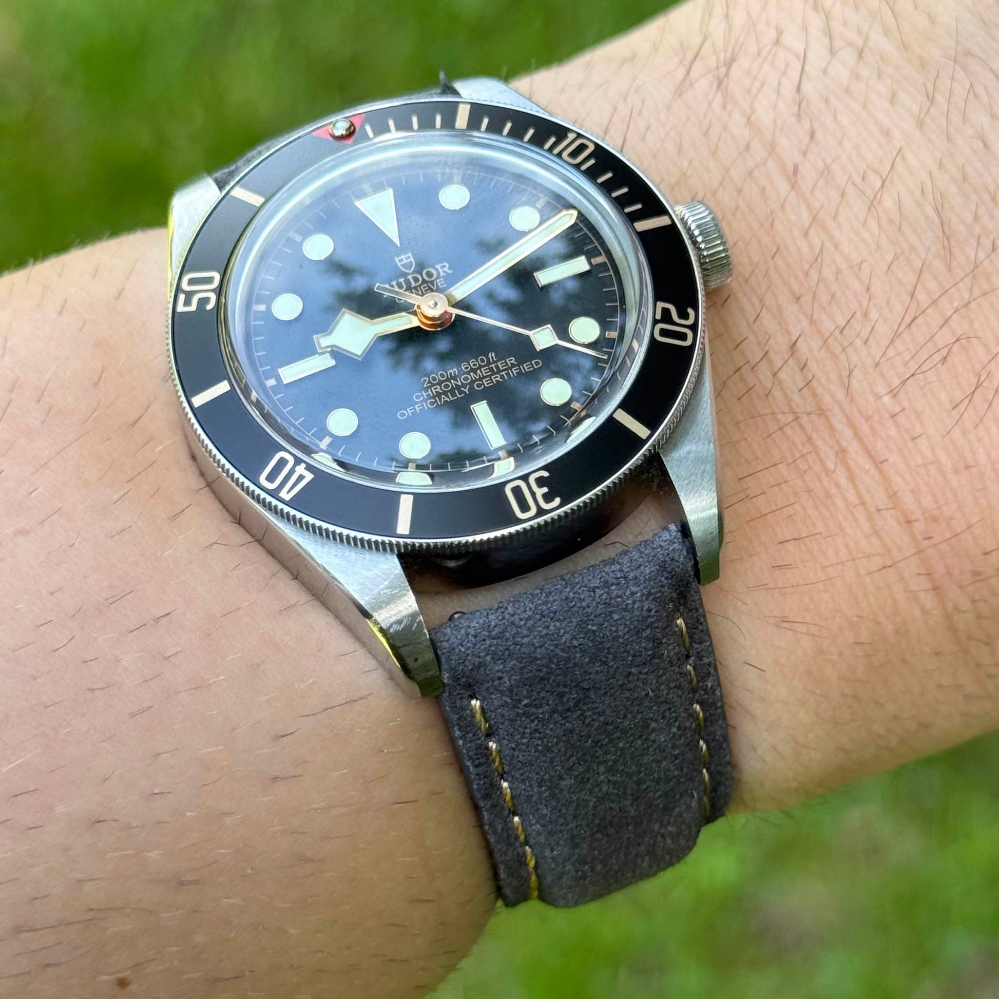 Wrist Shot of the Paris gunmetal suede watch strap. Contrast ivory stitching. 18mm, 20mm, 22mm, 24mm. Watch And Strap.