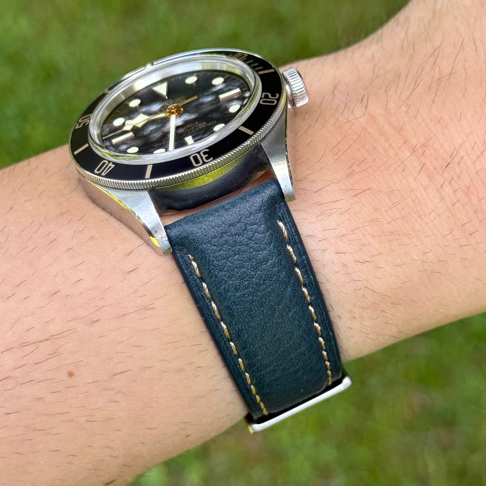 Wrist shot of the Rome Prussian blue full grain Italian leather watch strap with ivory stitching. Watch And Strap.