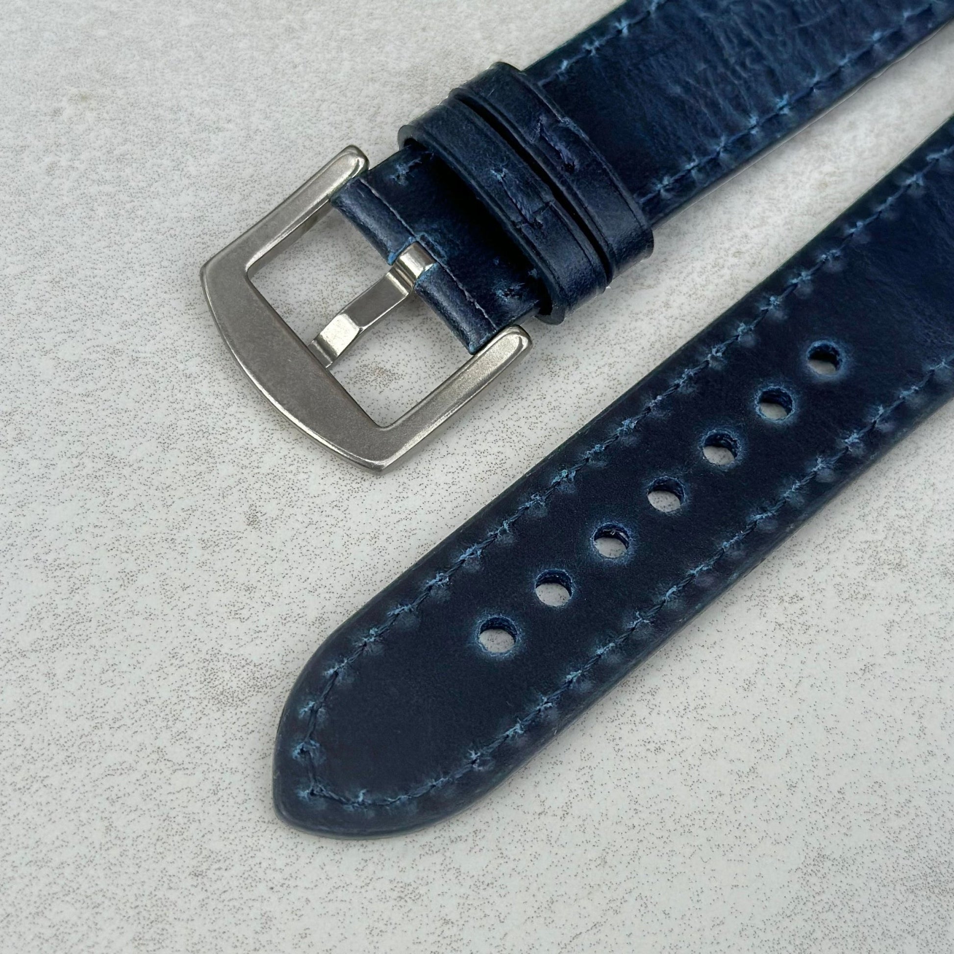 Underside of the 316L stainless steel buckle on the Athens deep Ocean blue full grain leather watch strap.