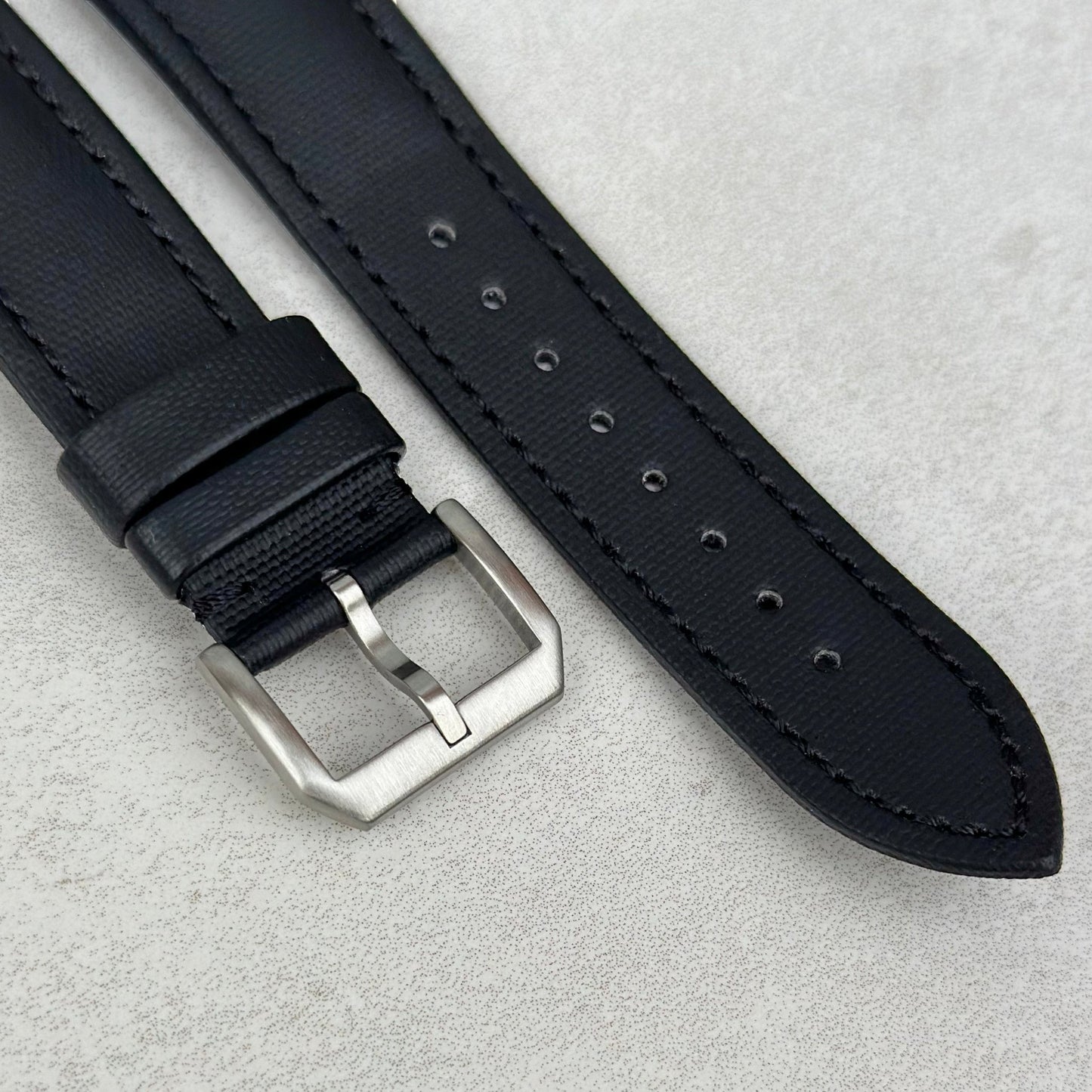 Brushed 316L stainless steel buckle on the Bermuda jet black sail cloth Apple Watch strap. Watch And Strap