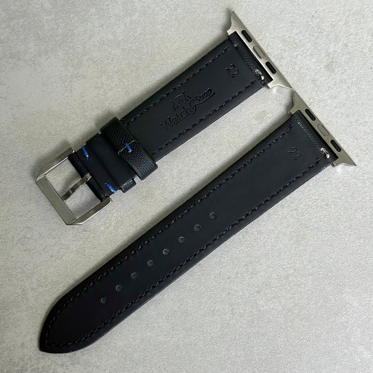 Rear of the jet black Sail cloth Apple Watch strap with blue stitching. Black leather rear. Watch And Strap