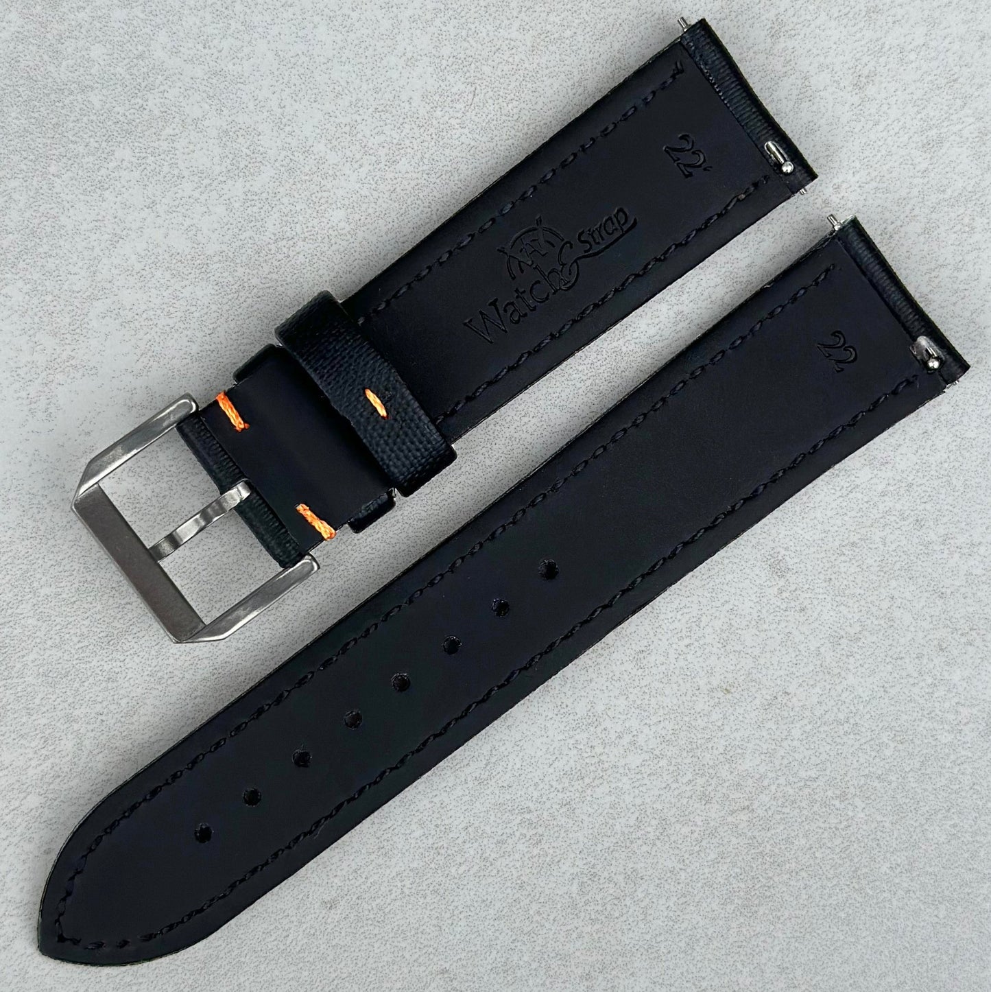 Rear of the Bermuda jet black sail cloth watch strap with contrast orange stitching. Quick release pins. Watch And Strap.