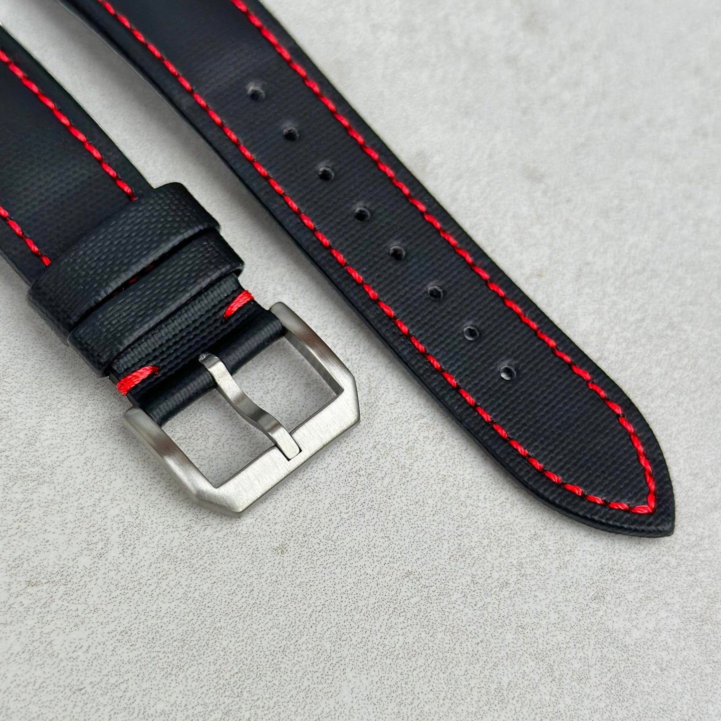 Brushed 316L stainless steel buckle on the Bermuda jet black sail cloth watch strap with contrast red stitching.