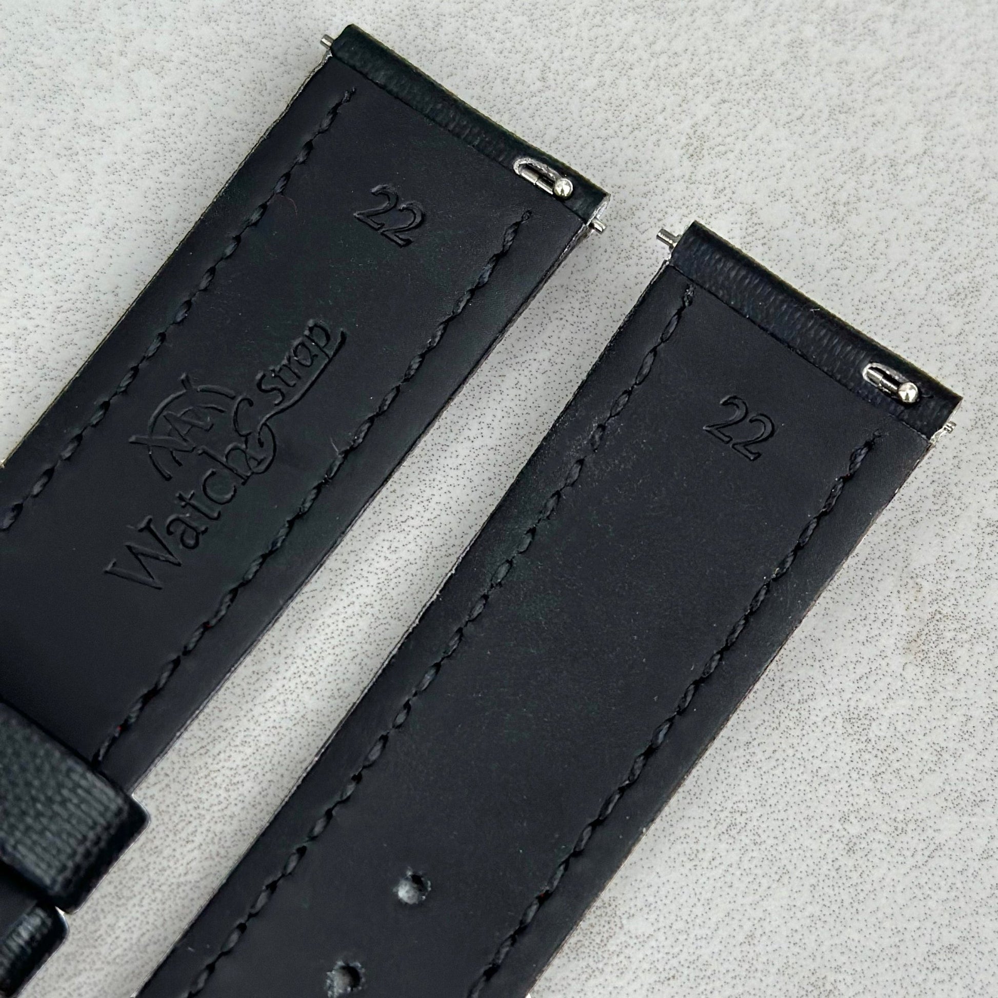 Quick release pins on the Bermuda jet black sail cloth watch strap. Watch And Strap logo.