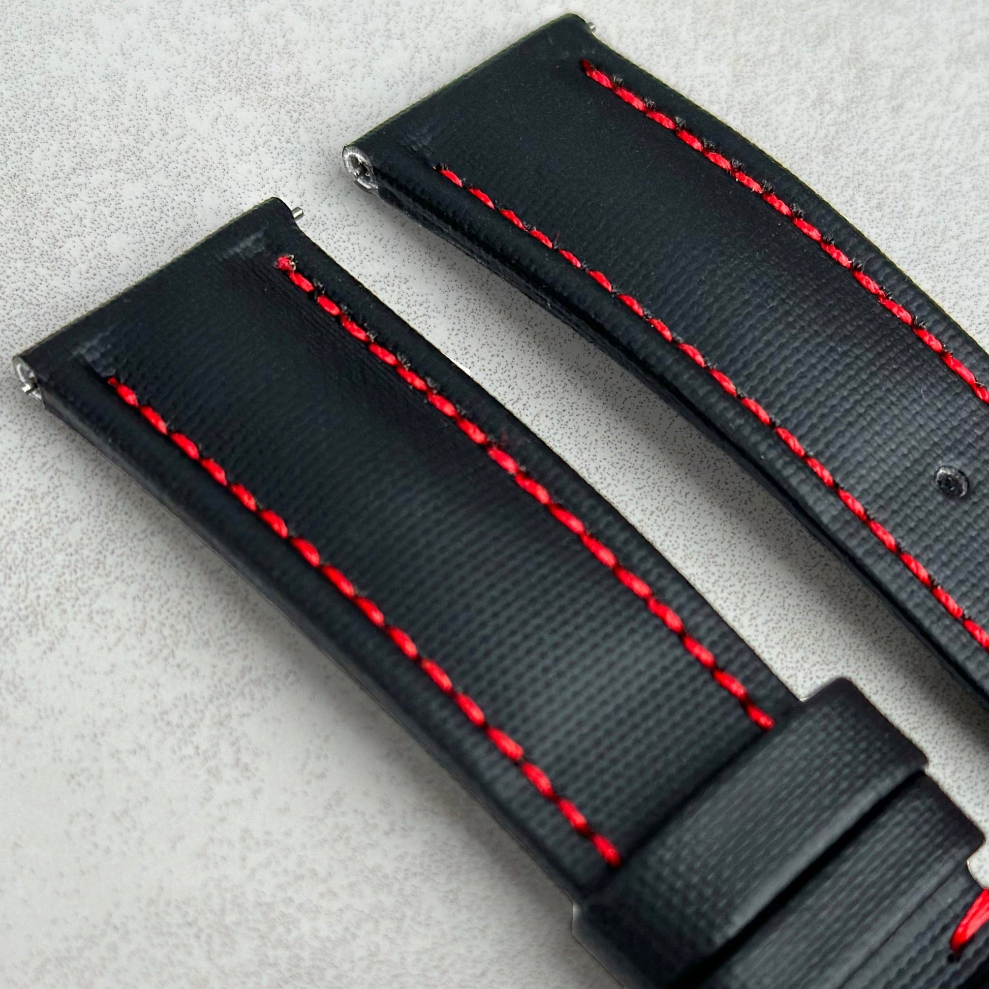 Top of the Bermuda jet black sail cloth watch strap with contrast red stitching. Padded sail cloth strap. Watch And Strap.