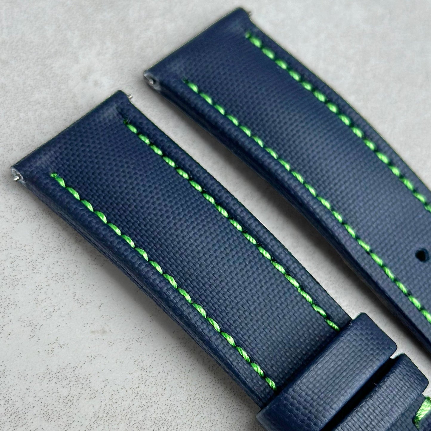 Top of the Bermuda navy blue sail cloth watch strap with contrast green stitching. Watch And Strap