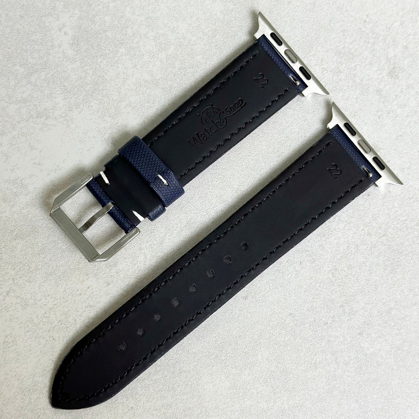 Rear of the navy blue sail cloth strap with white stitching. Black leather rear. Watch And Strap