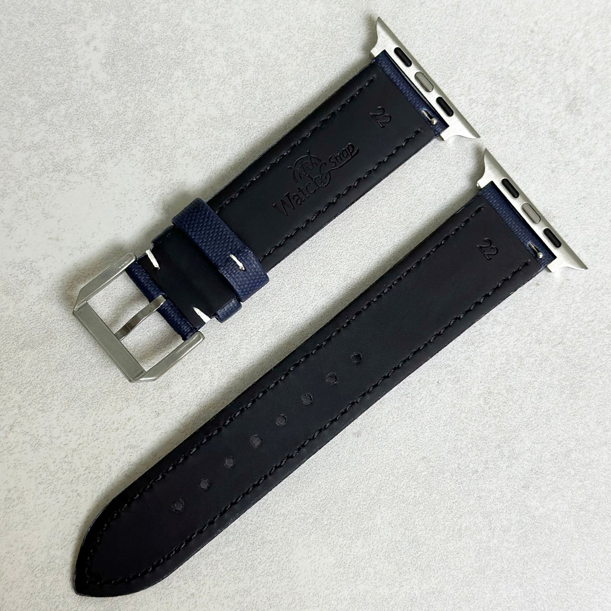 Rear of the navy blue sail cloth strap with white stitching. Black leather rear. Watch And Strap