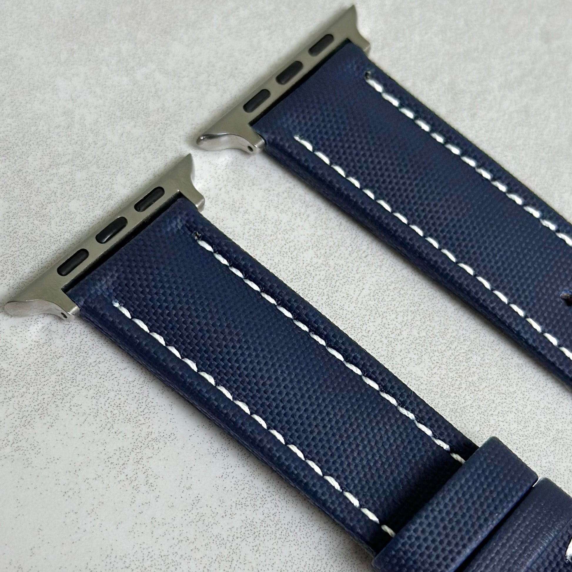 Top of the Bermuda navy blue sail cloth Apple Watch strap with white stitching. Watch And Strap