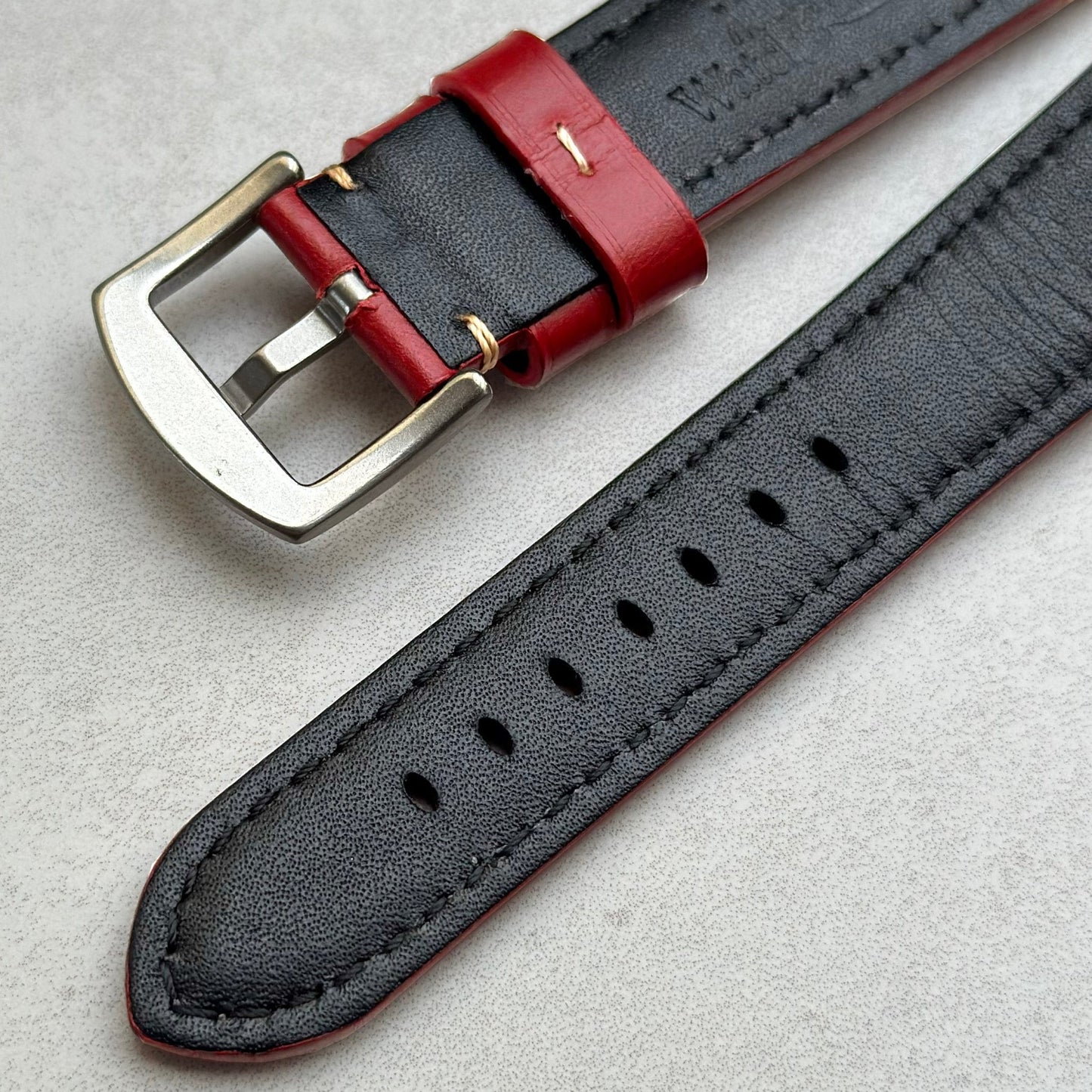 Underside buckle of the Oslo red full grain leather watch strap.