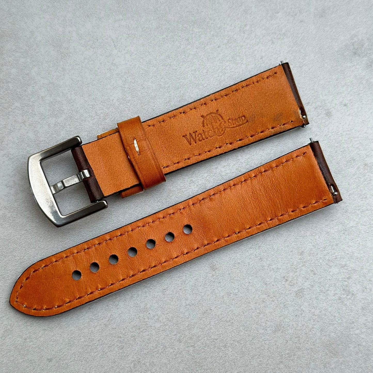 Rear of the Oxford brown full grain leather watch strap. Watch And Strap logo. Quick release pins.