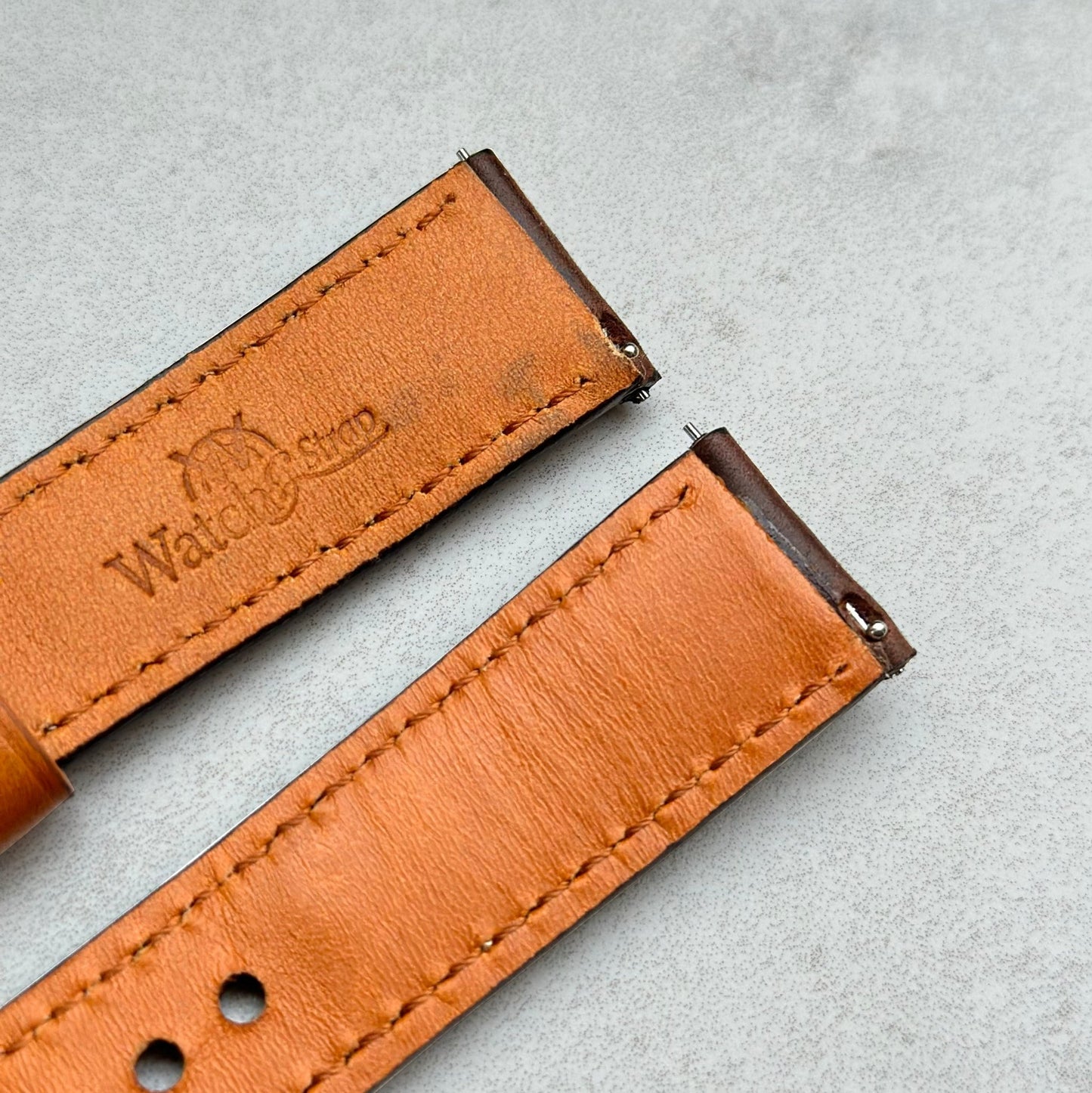 Quick release pins on the Oxford brown full grain leather watch strap. Watch And Strap logo.
