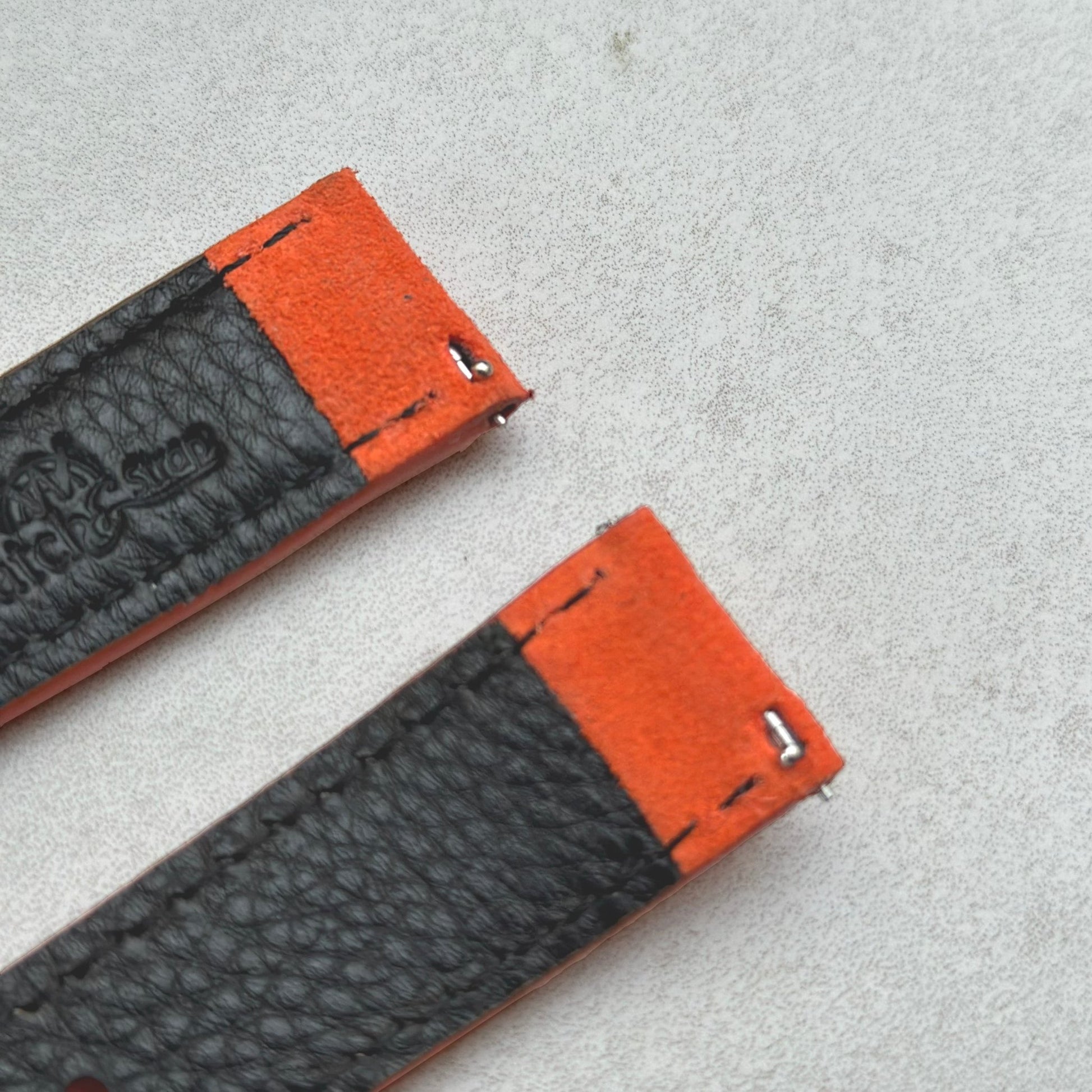 Quick release pins on the Paris orange suede watch strap. 18mm, 20mm, 22mm, 24mm. Watch And Strap logo.