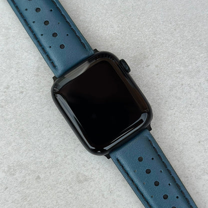 Le Mans petrol blue and black full grain leather apple watch strap on an Apple watch. 